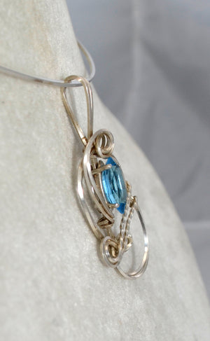 Petite Blue Topaz Pendant hand sculpted in Sterling Silver .925 wire